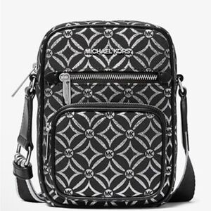 Michael Kors NWT Jet Set black and silver crossbody with guitar strap, NWT